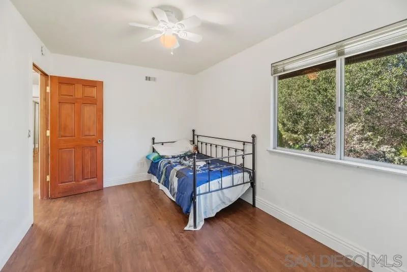 14578 Rios Canyon Road El Cajon, CA 92021 - Photo 36 of 61 a bedroom with a bed and a window