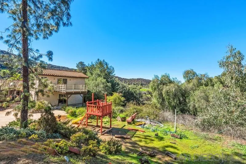 14578 Rios Canyon Road El Cajon, CA 92021 - Photo 49 of 61 a backyard of a house with table and chairs