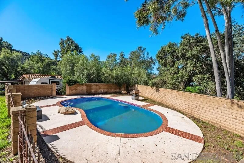 14578 Rios Canyon Road El Cajon, CA 92021 - Photo 53 of 61 a view of a swimming pool with an outdoor seating