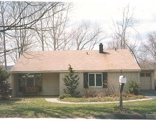 219 Adley Road Fairfield, CT 06825 - Photo 1 of 1 a front view of a house with a yard and garage