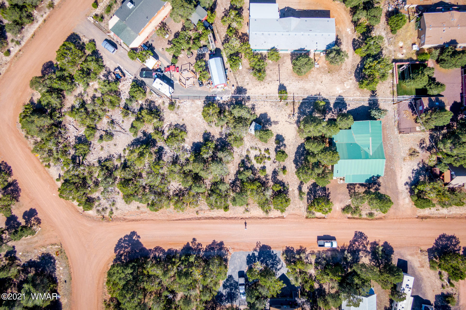 3524 Pine Rim Drive Overgaard, AZ 85933 - Photo 17 of 26 an aerial view of a house with a yard and lake view