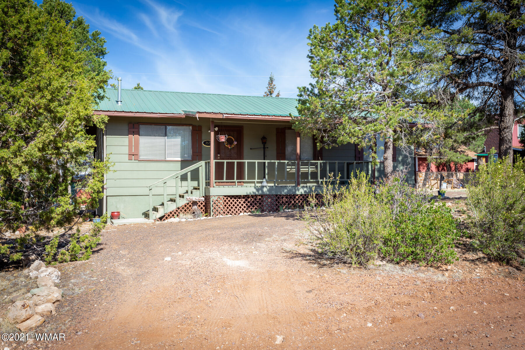 3524 Pine Rim Drive Overgaard, AZ 85933 - Photo 23 of 26 a view of a house with a patio