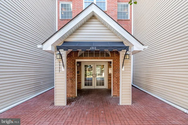 a view of a house with wooden deck