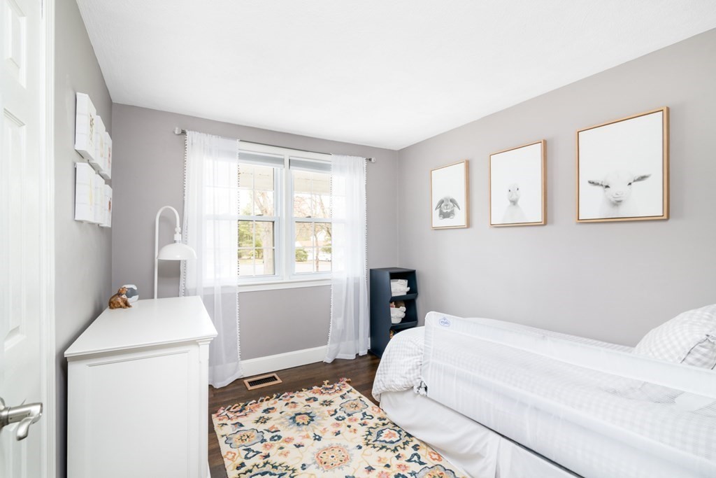 7 Geraldine Lane Braintree, MA 02184 - Photo 12 of 26 a bedroom with a bed and a window