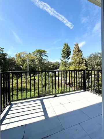 a view of balcony with furniture