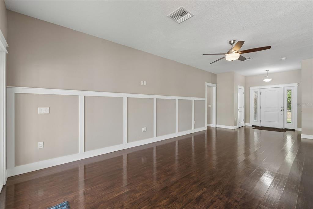 29913 Darby Road Dade City, FL 33525 - Photo 14 of 100 wooden floor in an empty room with a window
