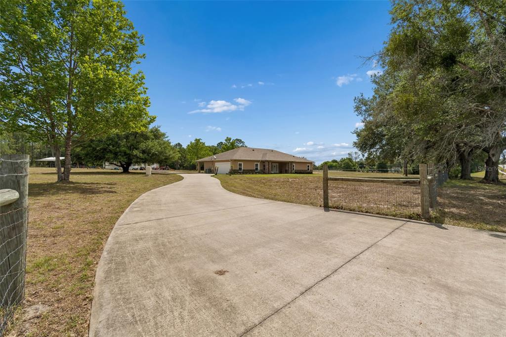 29913 Darby Road Dade City, FL 33525 - Photo 2 of 100 a view of outdoor space with deck and yard