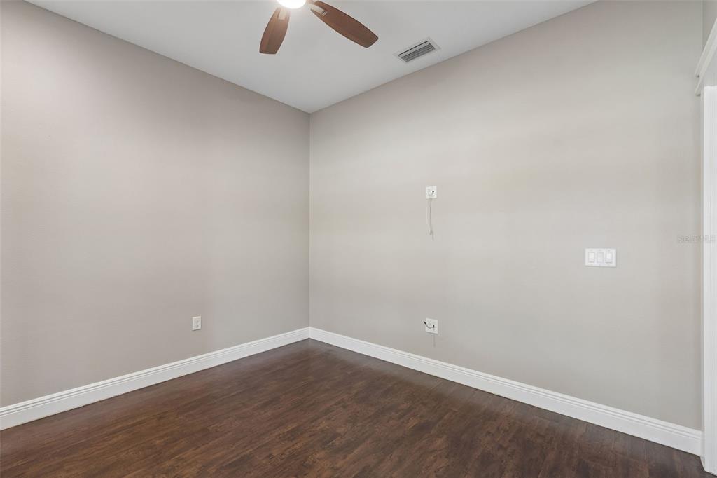 29913 Darby Road Dade City, FL 33525 - Photo 37 of 100 an empty room with a empty space and chandelier fan