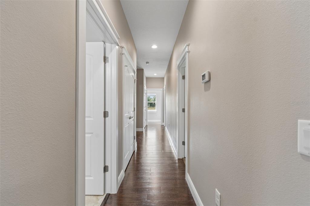 29913 Darby Road Dade City, FL 33525 - Photo 38 of 100 a view of hallway with wooden floor
