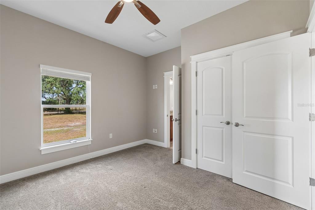 29913 Darby Road Dade City, FL 33525 - Photo 44 of 100 a view of an empty room with a window