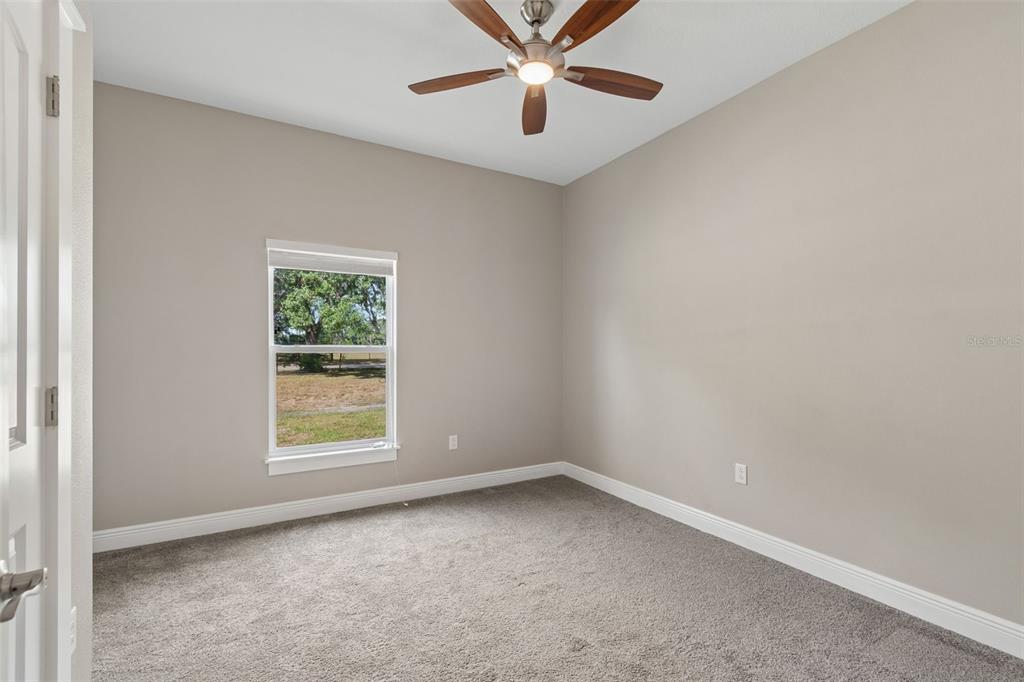 29913 Darby Road Dade City, FL 33525 - Photo 49 of 100 an empty room with a window and a fan