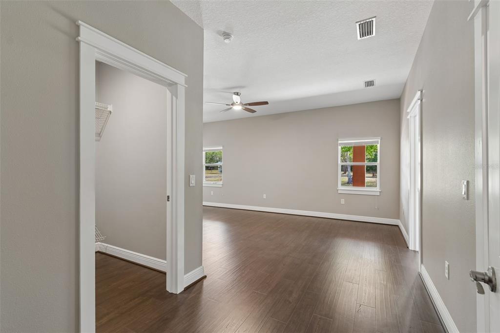29913 Darby Road Dade City, FL 33525 - Photo 53 of 100 a view of a hallway with wooden floor