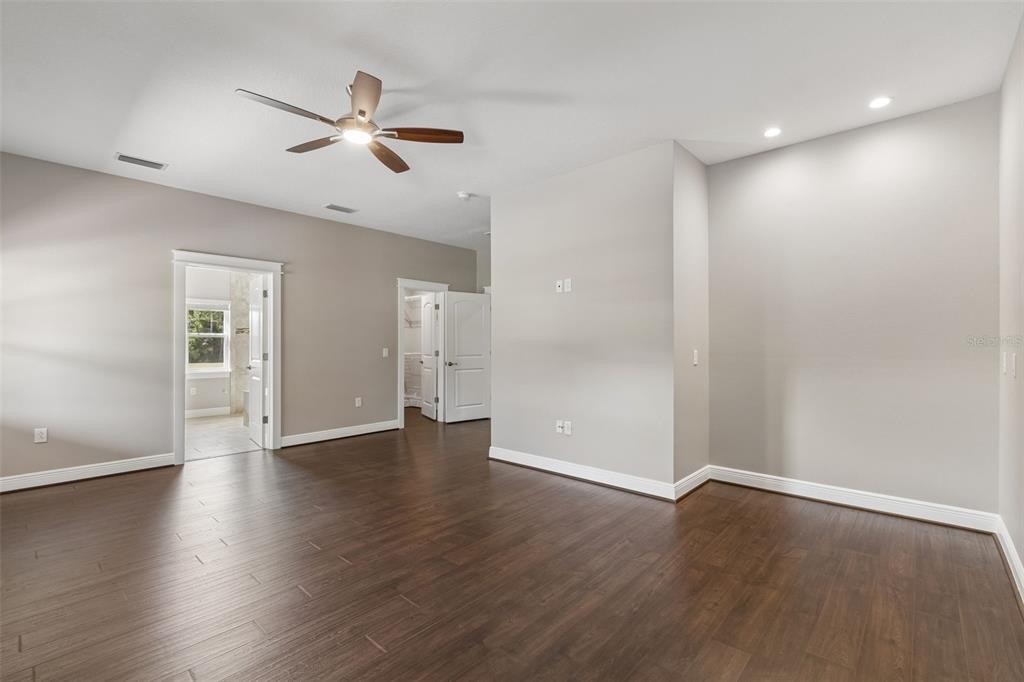 29913 Darby Road Dade City, FL 33525 - Photo 59 of 100 a view of an empty room with wooden floor
