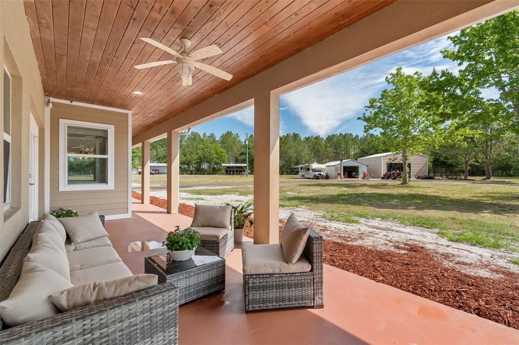 29913 Darby Road Dade City, FL 33525 - Photo 78 of 100 a view of a patio with couches and pool