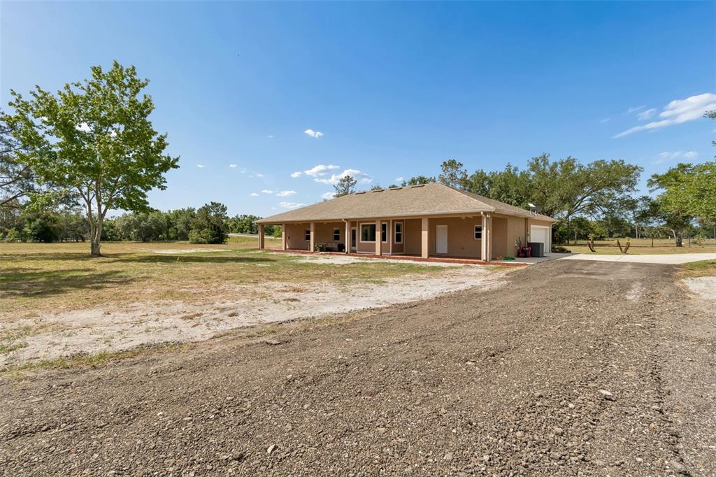 29913 Darby Road Dade City, FL 33525 - Photo 87 of 100 a front view of a house with a yard