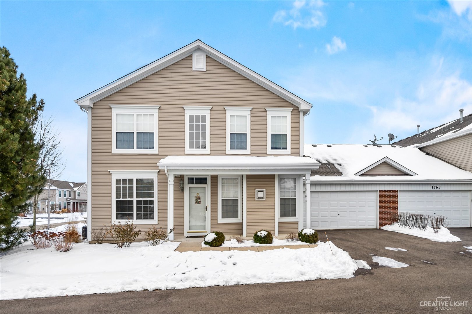 176b Brompton Lane, Unit A Sugar Grove, IL 60554 - Photo 1 of 17 a front view of a house with a yard