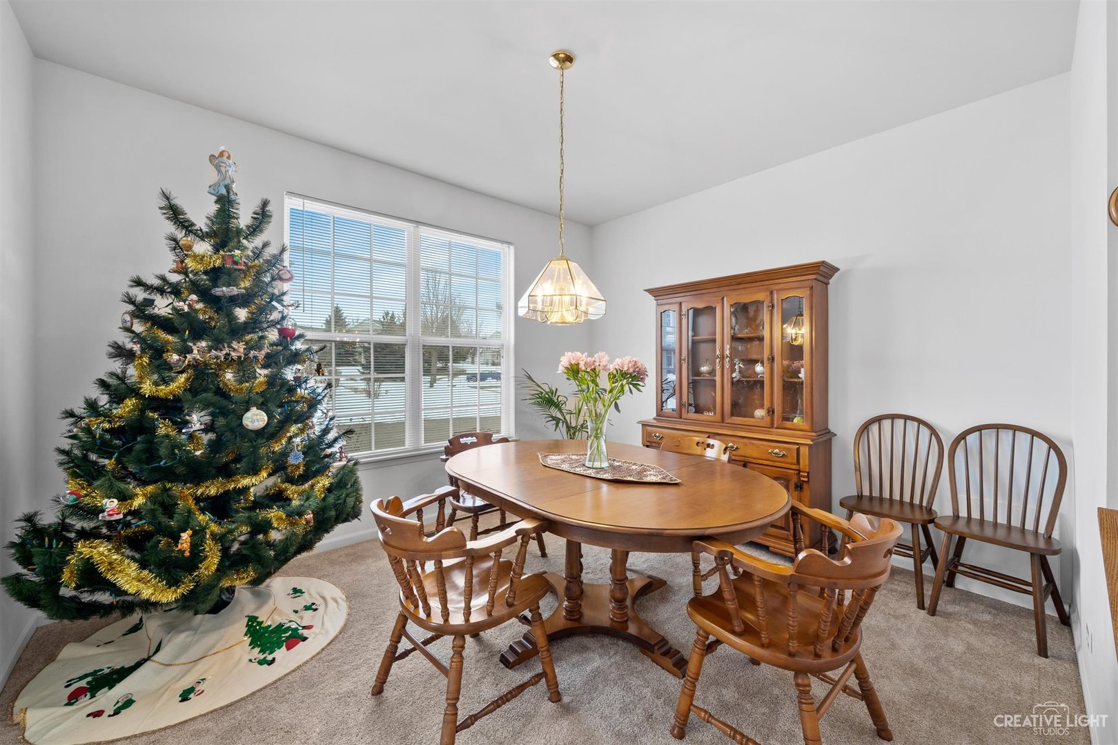 176b Brompton Lane, Unit A Sugar Grove, IL 60554 - Photo 5 of 17 a dining room with furniture a chandelier and wooden floor