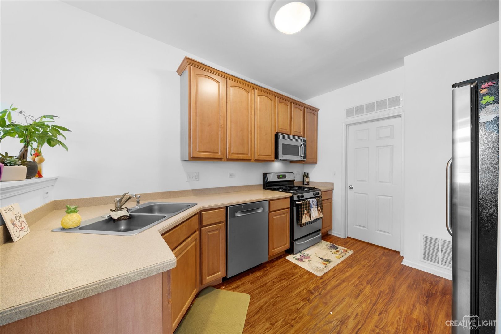 176b Brompton Lane, Unit A Sugar Grove, IL 60554 - Photo 9 of 17 a kitchen with a sink appliances and cabinets