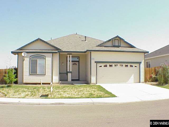 1423 Amston Road Reno, NV 89511 - Photo 1 of 1 a front view of a house with a yard and garage