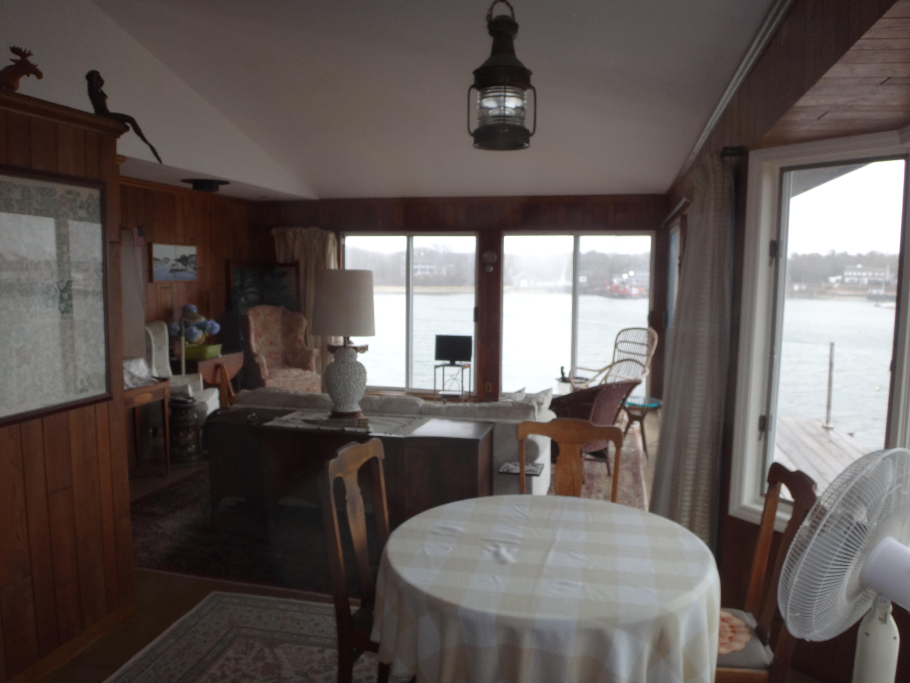 17 Bayview Road Harwich, MA 02646 - Photo 10 of 11 a view of a dining room with furniture window and outside view