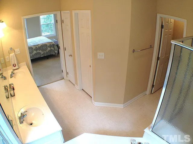 a view of a bedroom from a bathroom