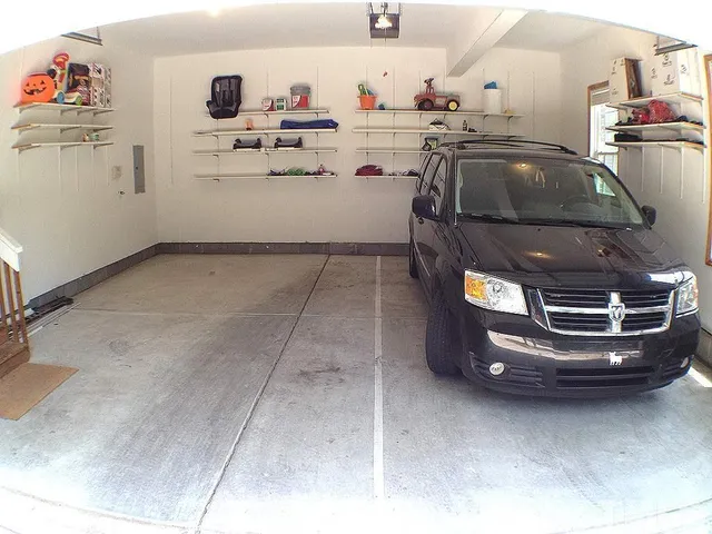 a utility room with a stove and cabinets