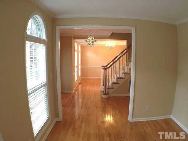 a view of entryway with wooden floor and a window