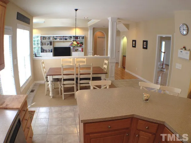 a kitchen with stainless steel appliances kitchen island granite countertop a sink and cabinets