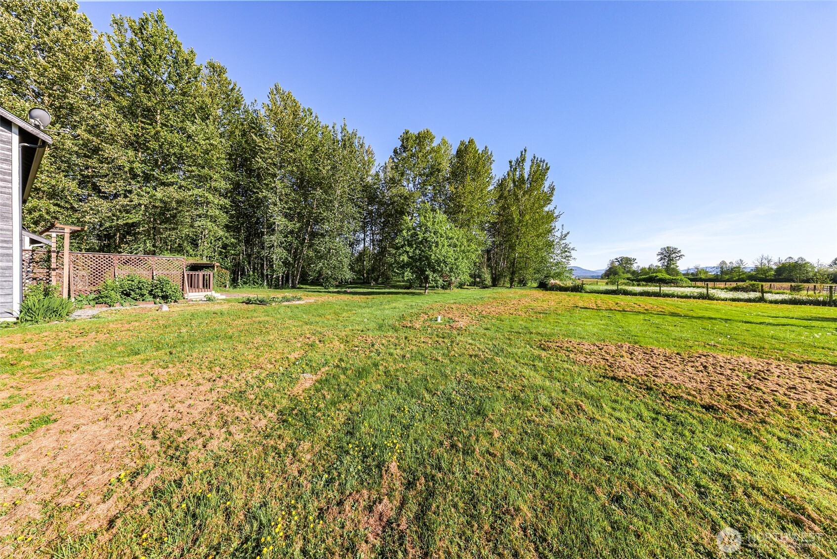 3395 Mack Road Everson, WA 98247 - Photo 37 of 39 a view of a golf course with a lake view