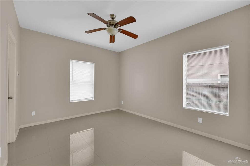 3004 South L Street, Unit 4 McAllen, TX 78503 - Photo 8 of 13 an empty room with a window