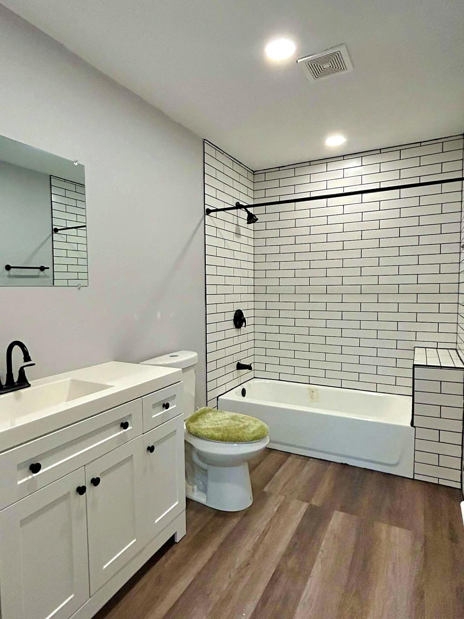 341 Central Avenue, Unit 1 Clewiston, FL 33440 - Photo 4 of 11 a bathroom with a sink a toilet and shower