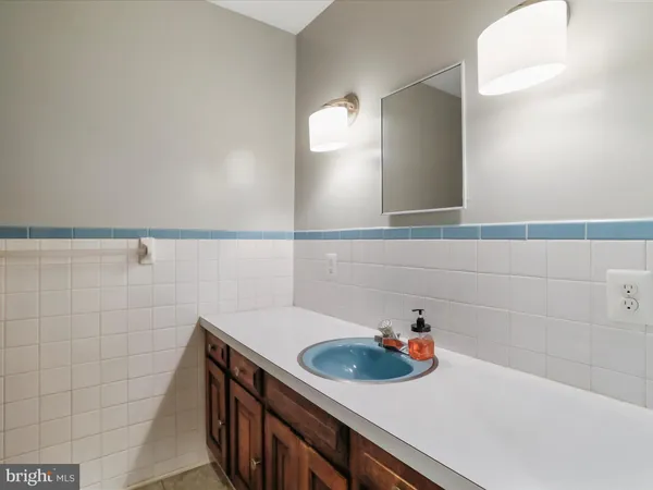 a white toilet sitting next to a small bathroom