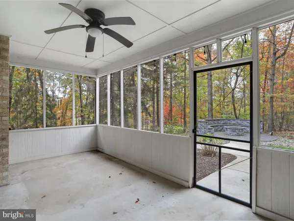 a view of room with window and ceiling fan