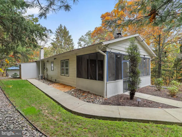 a view of a house with a yard and garage