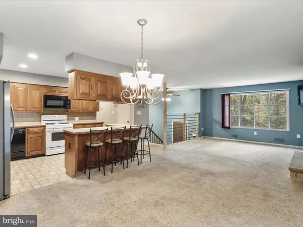a view of a kitchen and dining room