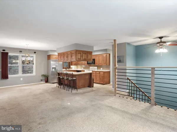 a kitchen with a sink and a refrigerator