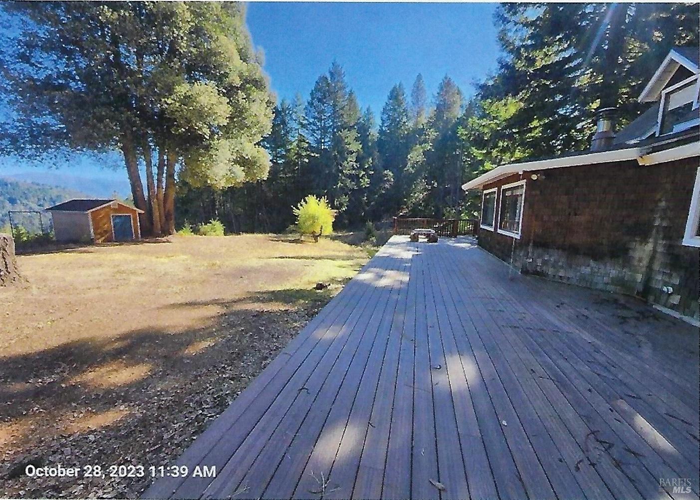 7020 Hearst Road Willits, CA 95490 - Photo 3 of 13 a view of a backyard with wooden floor and fence