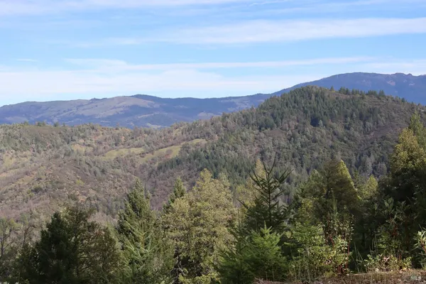 a view of mountains and valleys