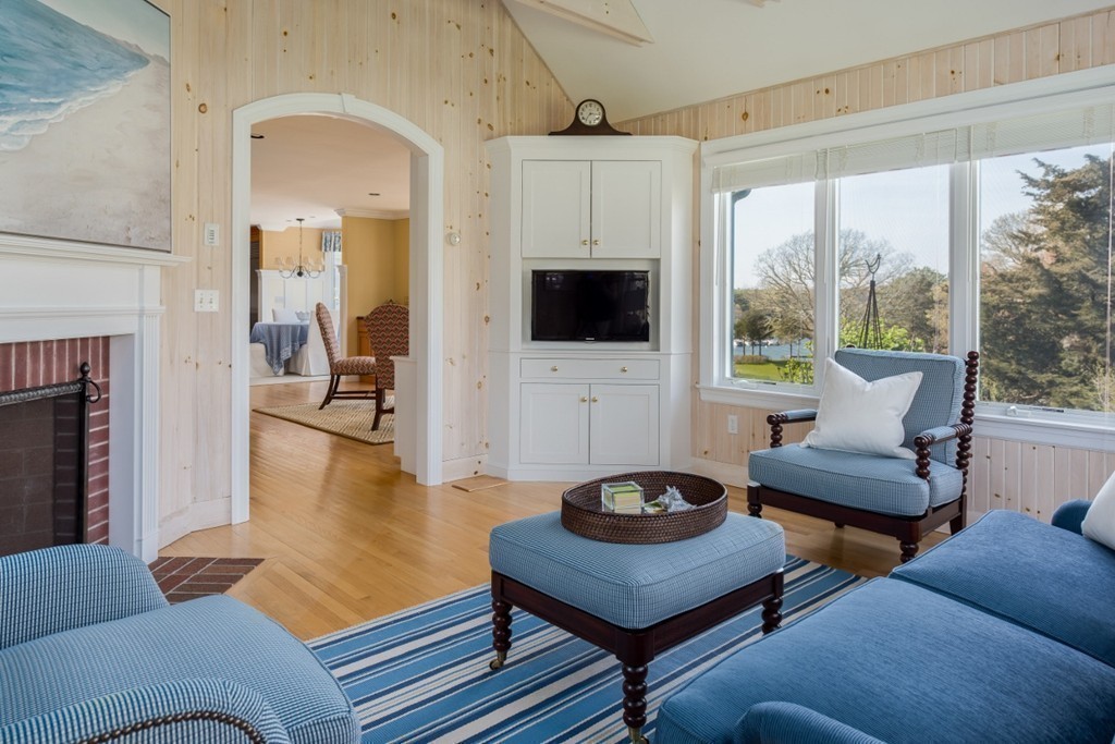 2 Captain Sears Way Chatham, MA 02633 - Photo 12 of 28 a living room with furniture a flat screen tv and a fireplace