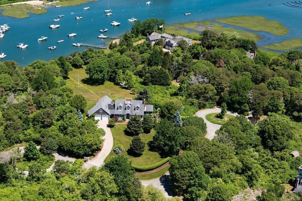2 Captain Sears Way Chatham, MA 02633 - Photo 2 of 28 a view of a house with a swimming pool and garden