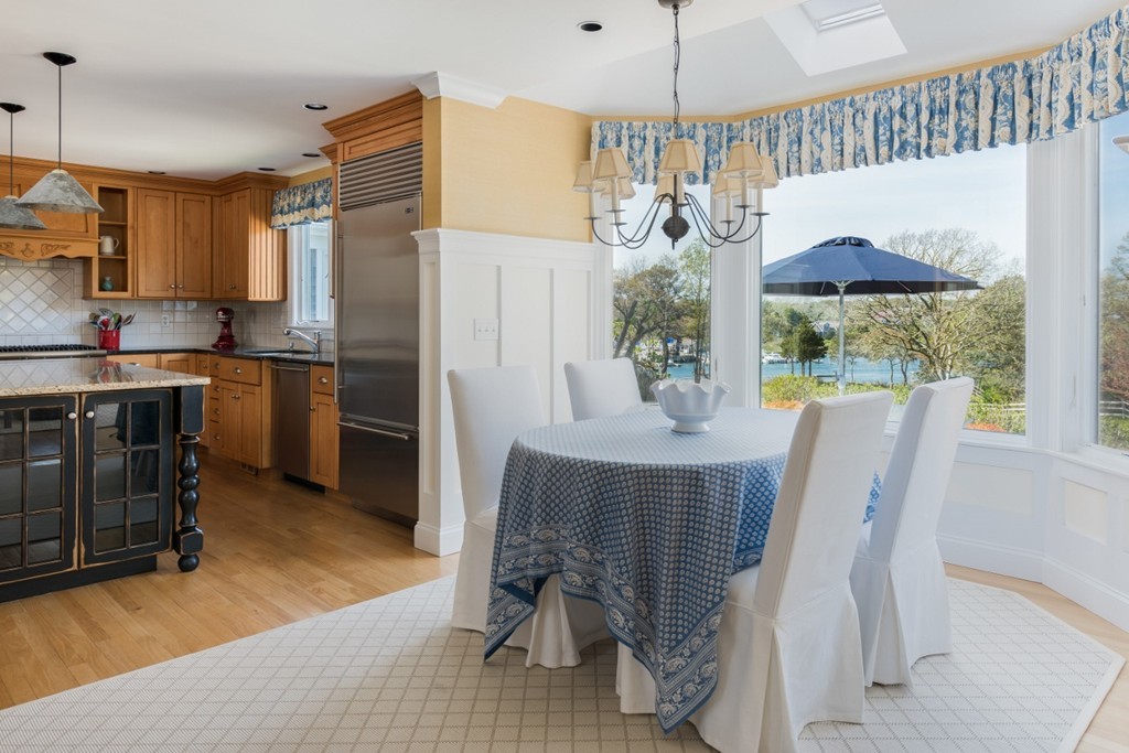 2 Captain Sears Way Chatham, MA 02633 - Photo 7 of 28 a kitchen with a table chairs refrigerator and microwave