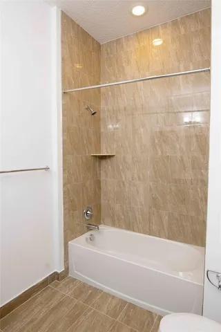 a bathroom with a sink a mirror and wooden floor