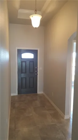 a view of a chandelier fan and closet area