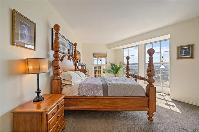 a bedroom with bed and a night stand