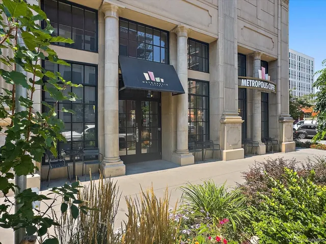 a view of a building with a tree in front of building