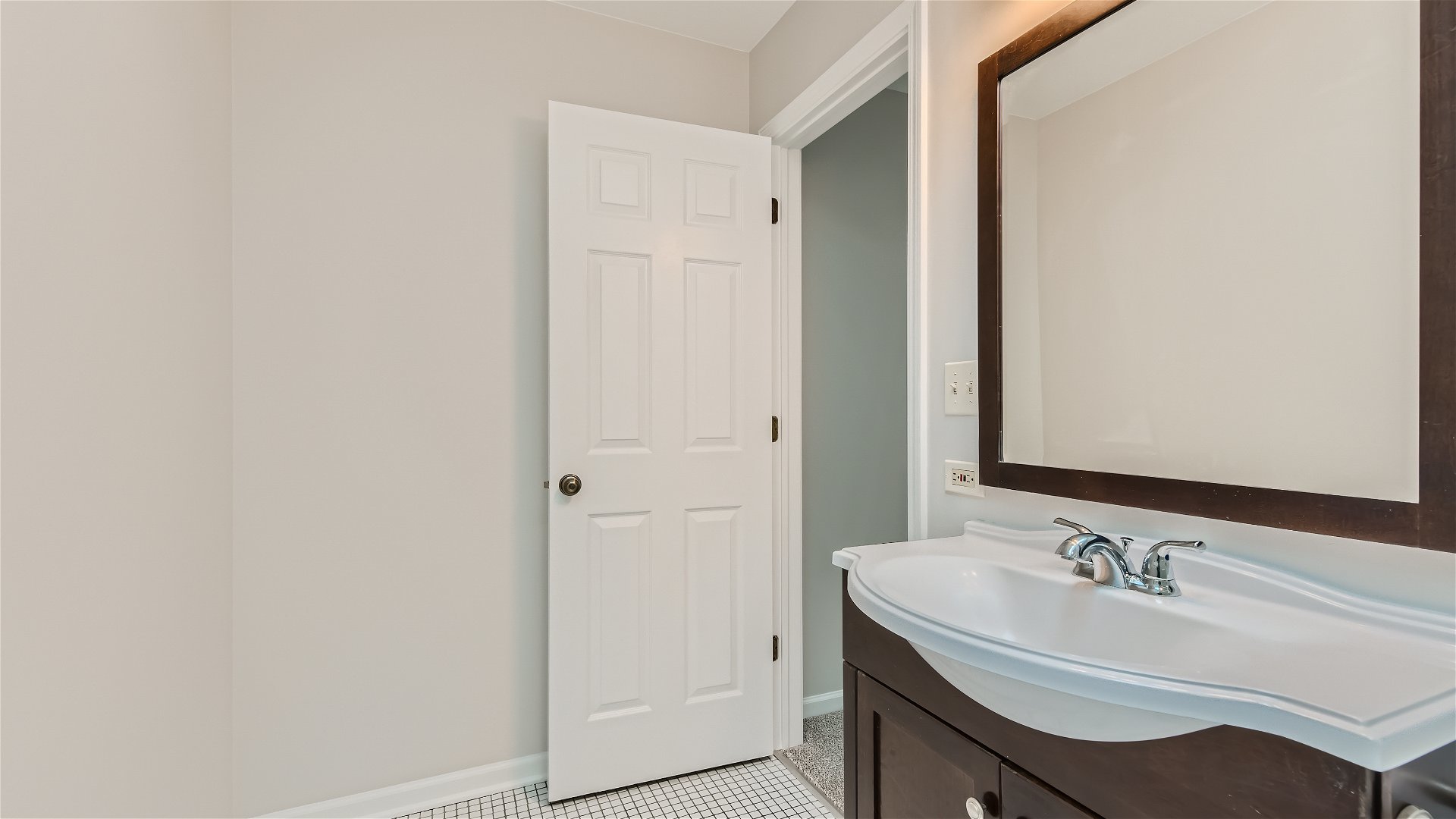 1223 Sumac Trail Hoffman Estates, IL 60192 - Photo 11 of 28 a bathroom with a sink and a mirror