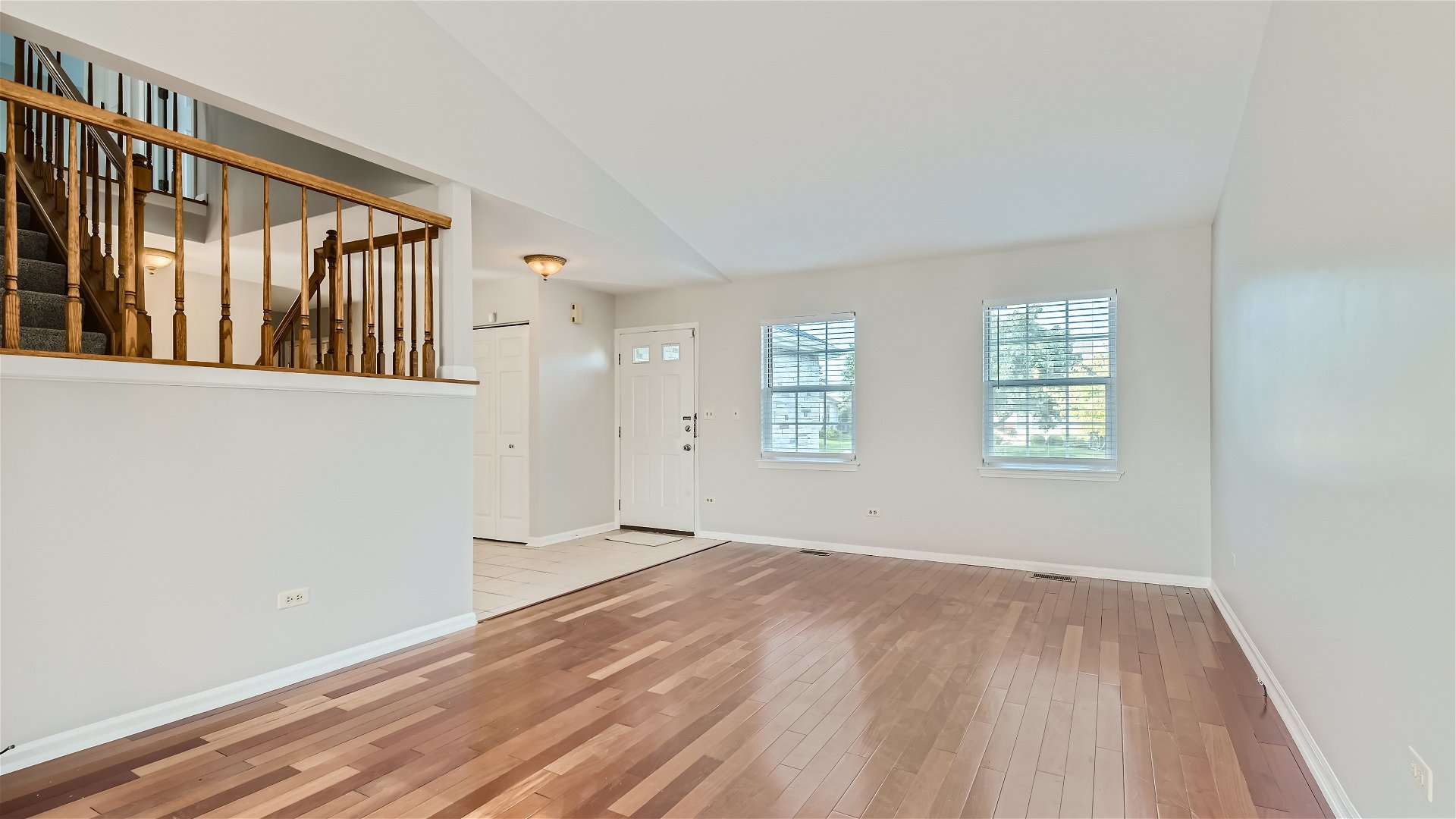 1223 Sumac Trail Hoffman Estates, IL 60192 - Photo 14 of 28 a view of an empty room with wooden floor and a window
