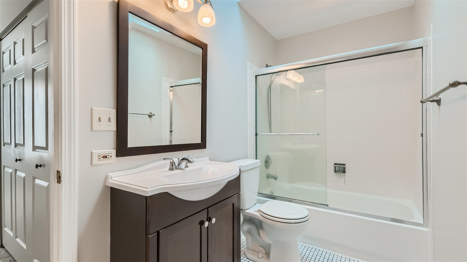 1223 Sumac Trail Hoffman Estates, IL 60192 - Photo 10 of 28 a bathroom with a sink a toilet and shower