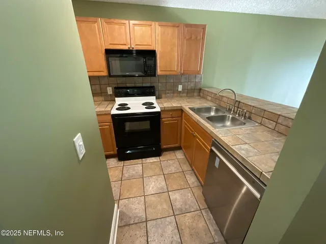 a bathroom with a sink and a washing machine