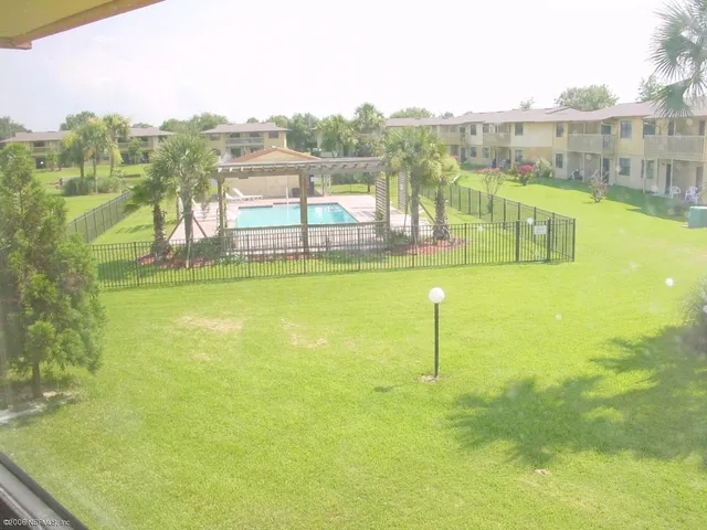 a view of balcony with wooden floor